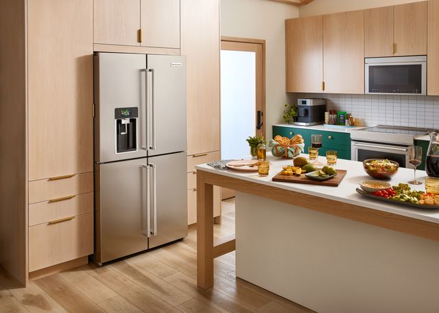front view of a KitchenAid french door stainless steel refrigerator in a modern kitchen