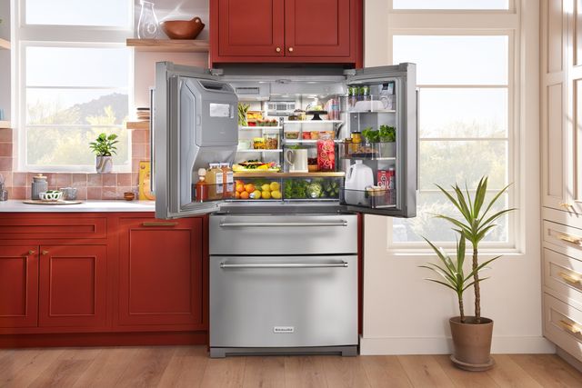 front view of a KitchenAid french door stainless steel refrigerator in a modern ktichen 