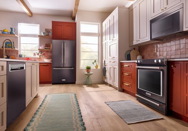 view of a transitional kitchen with black stainless steel KitchenAid appliances