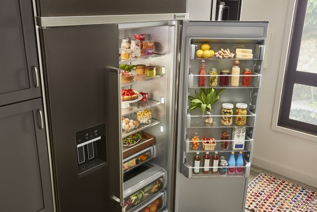 view of a kitchenaid side by side refrigerator with the right side opened