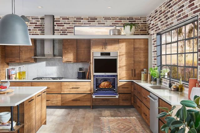 Front view of a modern kitchen with an LG Studio double wall oven