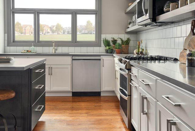 Front view of a modern kitchen with an LG stainless steel dishwasher
