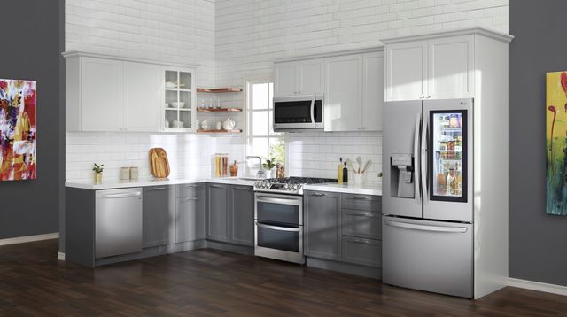 Front view of a modern kitchen with stainless steel LG applianes.