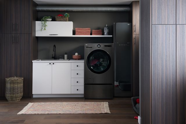 Front view of a modern laundry room with the LG 2-in-1 washer dryer combo and a drying cabinet