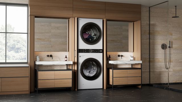 Front view of a luxury washroom with an LG WashTower between two sinks.