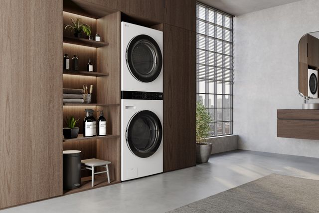 Front view of a modern laundry room with a white LG WashTower