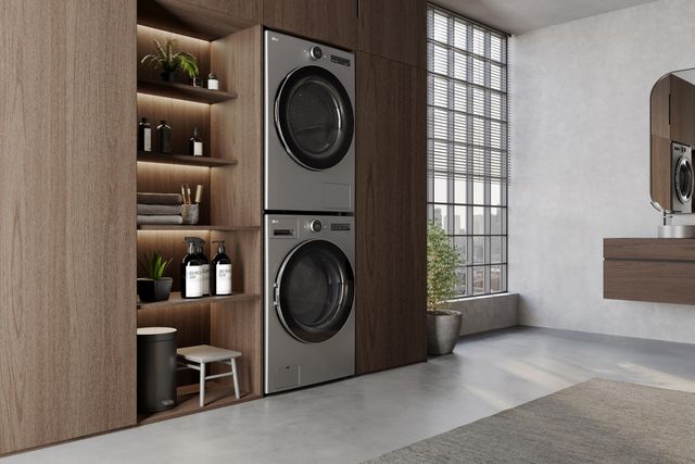 front view of a stacked washer and dryer in a modern laundry room