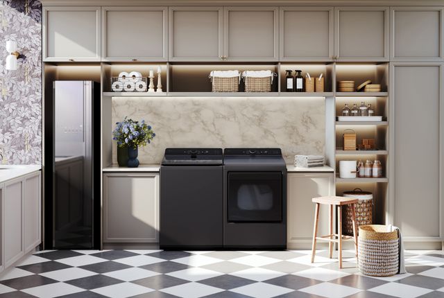 Front view of a luxury laundry room with a black washer and dryer with a drying cabinet.