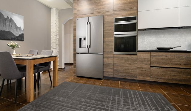 Front view of a modern kitchen with an LG built in refrigerator