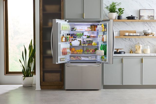 Front view of an opened LG french door counter depth refrigerator