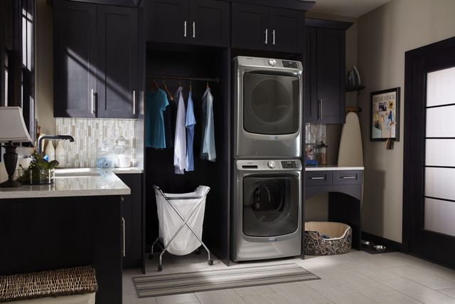 front view of a Maytag stackable washer and dryer in a modern laundry room