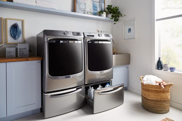 front view of a modern laundry room with a grey washer and dryer