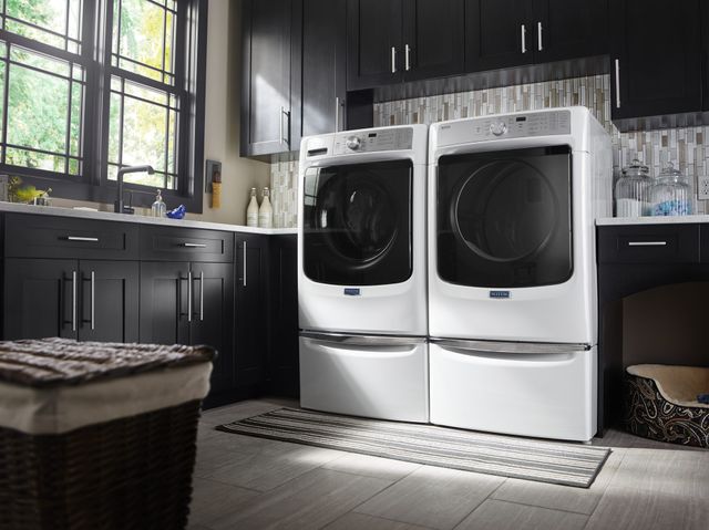 front view of a white Maytag washer and dryer in amodern laundry room
