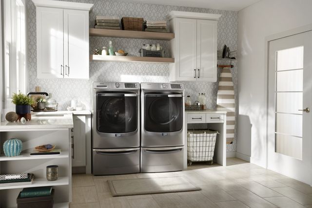 front view of a modern laundry room with a maytag washer and dryer
