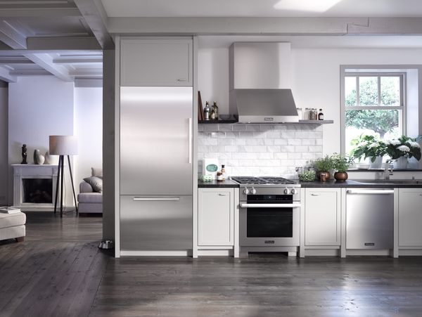 Stainless steel appliances are featured in a modern kitchen