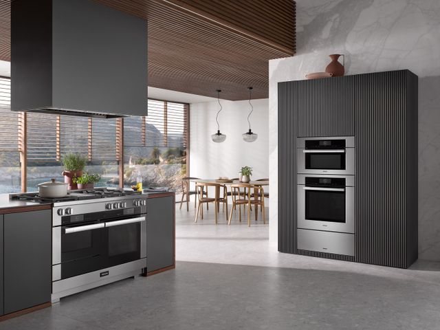 Front view of a luxurious kitchen with Miele applainces
