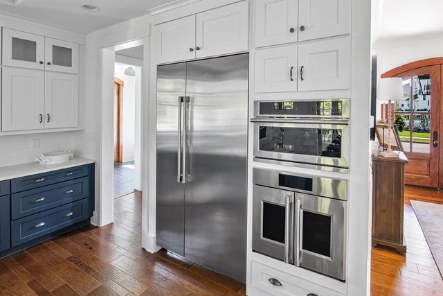 view of a modern kitchen with stainless steel Monogram appliances