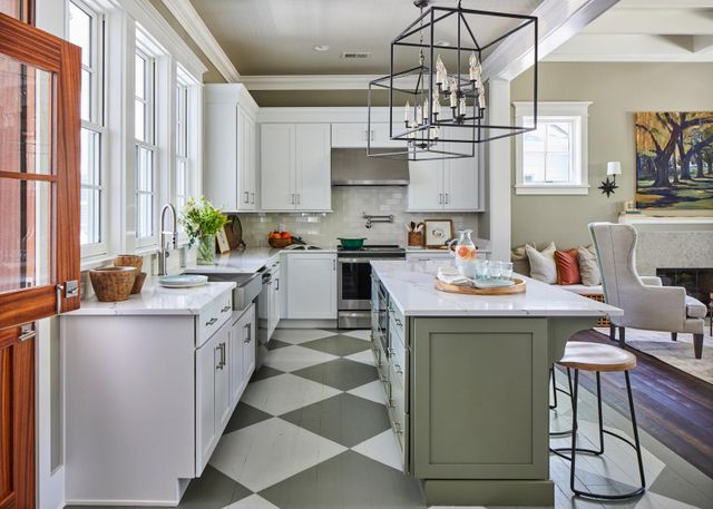 Front view of a modern kitchen with an over the range stainless steel hood