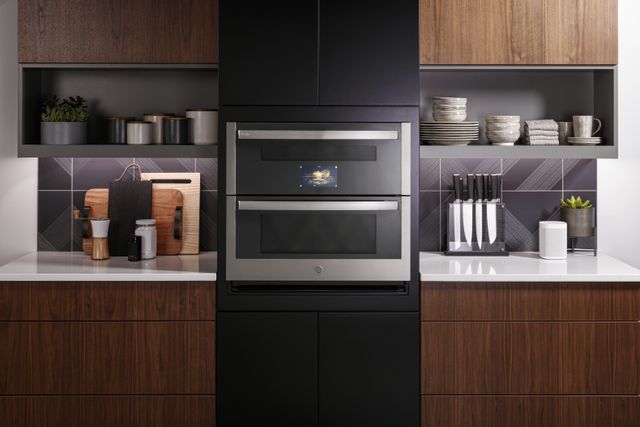Front view of a modern kitchen with a GE Profile wall oven