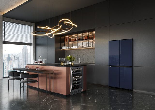 Front view of a modern kitchen with a sleek four door french door refrigerator for Samsung