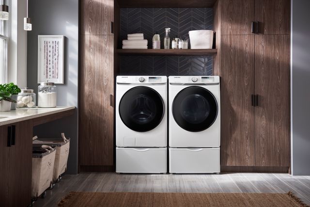 Front view of a modern laundry room with a Samsung washer and dryer