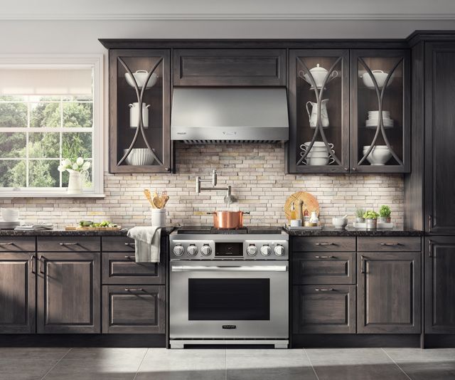 front view of a modern kitchen with a signature kitchen suite range and range hood