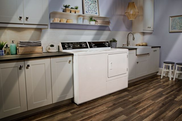 front view of a casual laundry room with a Speed Queen washer and dryer