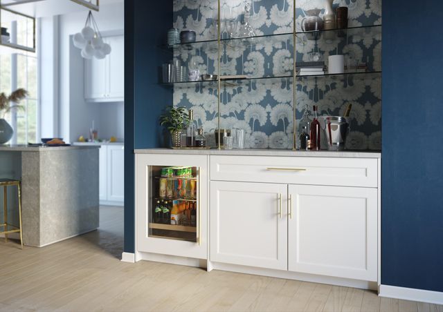 front view of a modern panel ready built in beverage refrigerator in white cabinetry