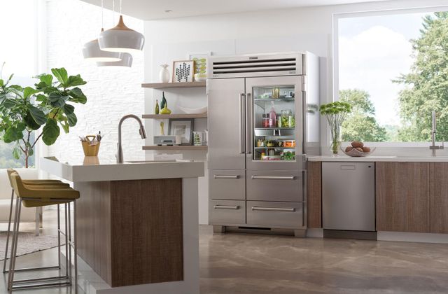 front view of a modern kitchen with a stainless steel sub-zero refrigerator