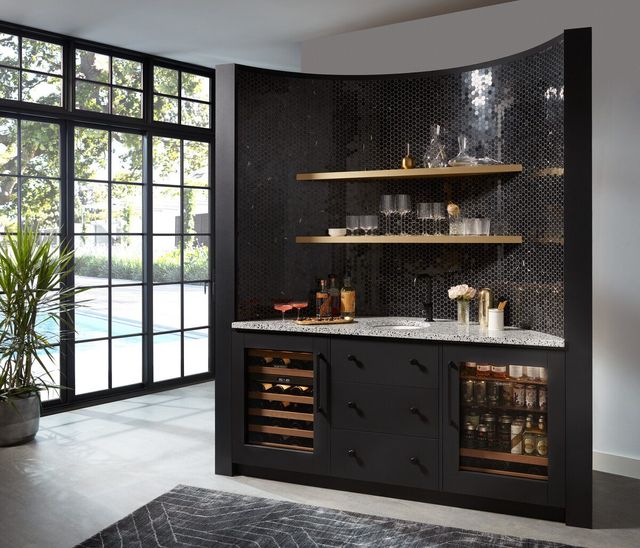 Front view of a luxury living space with a bulit in wine cooler and beverage center