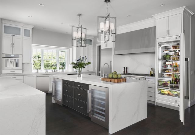 front view of a bright modern kitchen with Thermador appliances