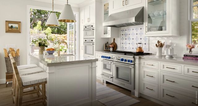 View of a modern kitchen with a Thermador range and Thermador stainless steel appliances.