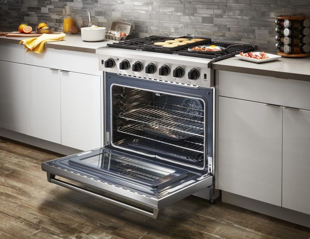 Front view of a modern kitchen with a Thor range 