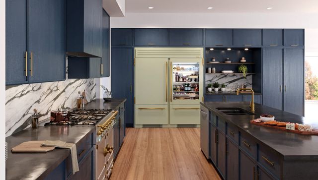 Front view of a luxury kitchen with panel-ready True residential refrigeration