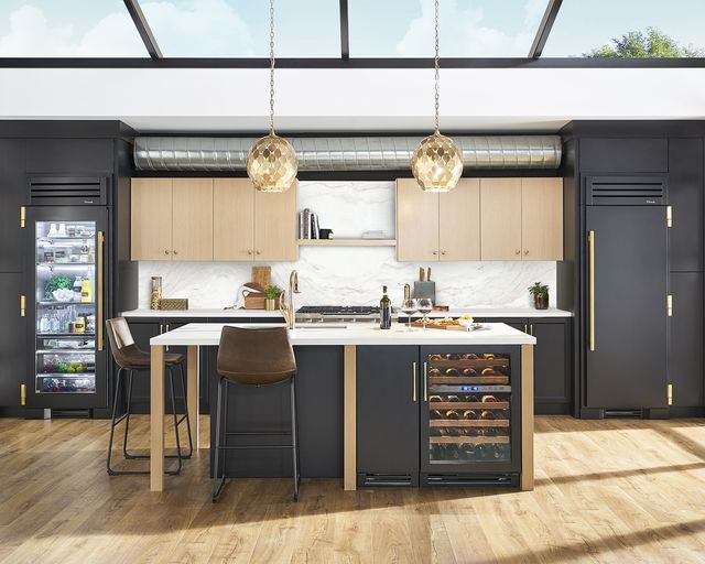 Front view of a modern kitchen with True residential refrigeration