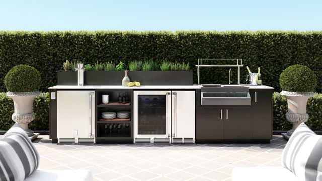 Front view of a modern Urban Bonfire outdoor kitchen with weather resistant outdoor fridges and storage options.