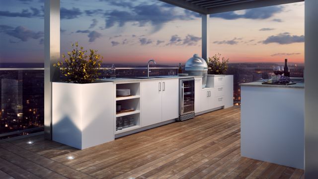 Front view of an outdoor bar and kitchen on a penthouse balcony.