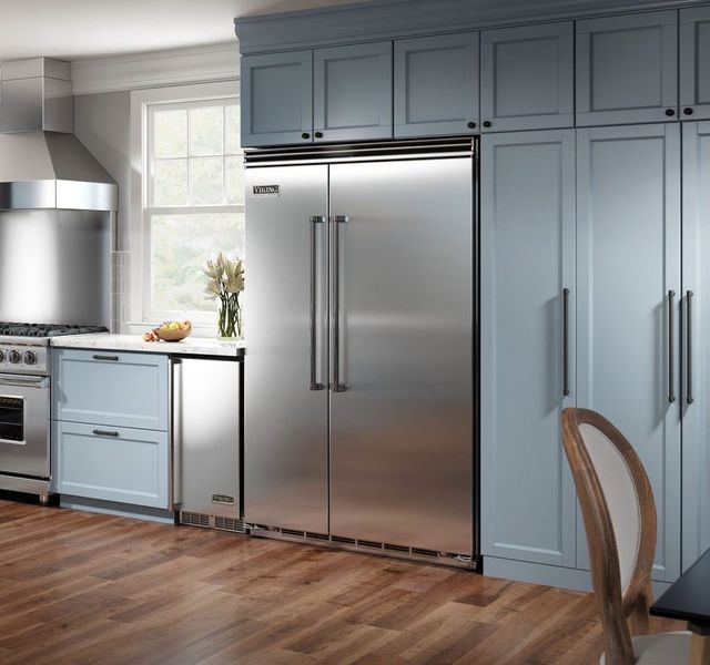 Front view of a large stainless steel Viking built in refrigerator in a modern kitchen