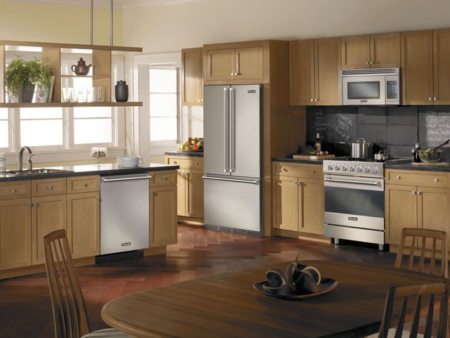front view of a modern kitchen with wooden cabinets and viking appliances including a dishwasher, refrigerator, microwave, and induction range