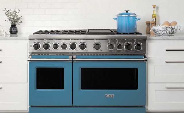 front view of a blue Viking range in a modern kitchen