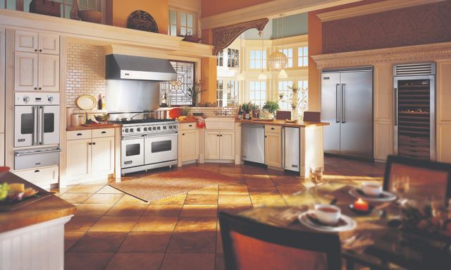 front view of a large rustic kitchen with a Viking pro range and other viking appliances