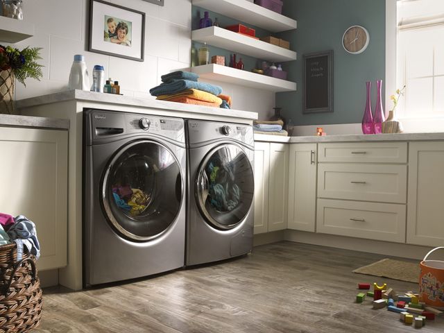 front view of a modern laundry room with a whirlpool washer and dryer 