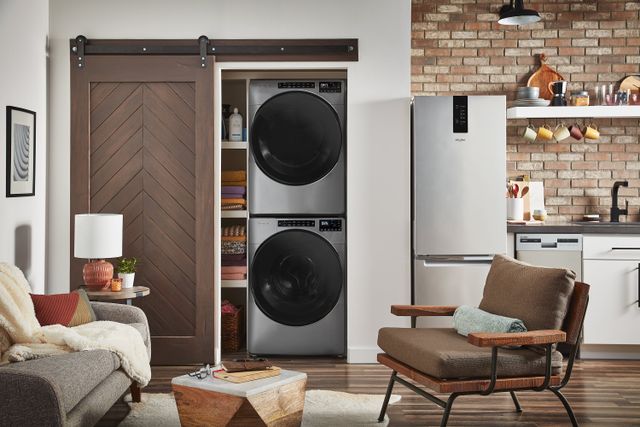 Front view of a modern home with a stackable washer and dryer in a closet