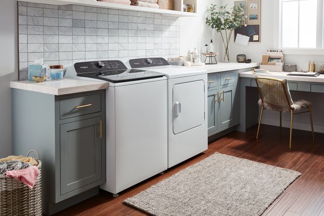 front view of a modern laundry room with a whirlpool washer and dryer