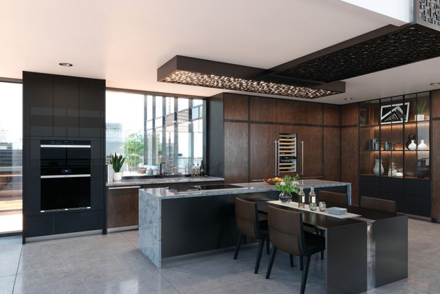 front view of a luxury kitchen with a Wolf induction cooktop in an island