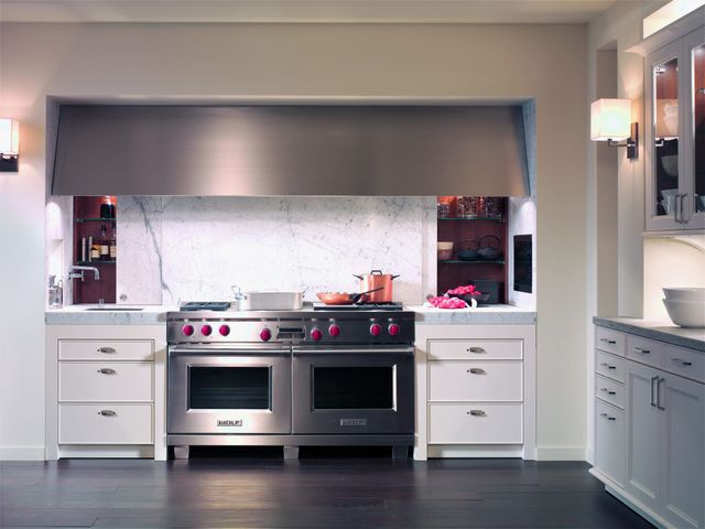 front view of a modern kitchen with a 60" wold range