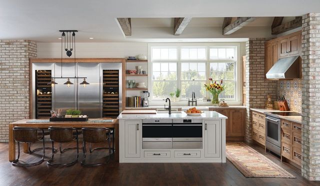 Front view of a modern luxury kitchen with Wolf and Sub-Zero appliances.
