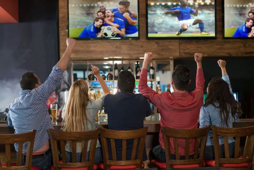 Customer at Bar Watching a Sports Game