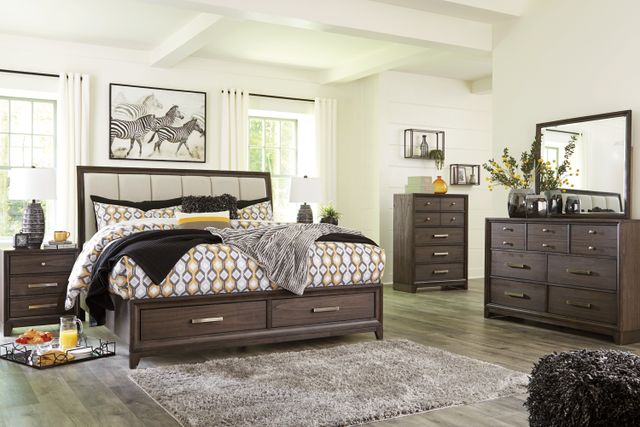front view of a wooden modern bedroom furniture set in a casual bedroom with white walls