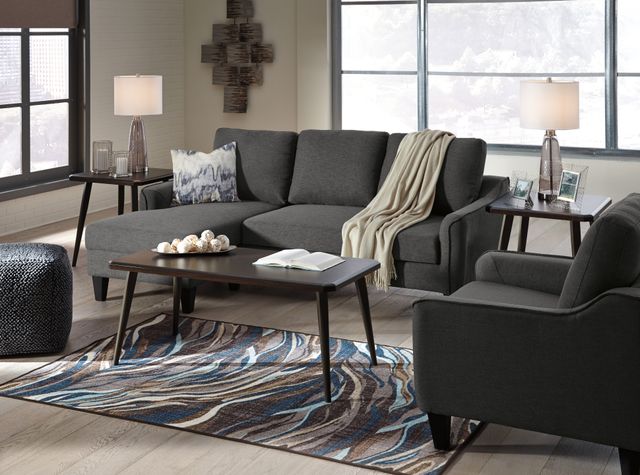 Front view of a modern living room with a three piece tablr set